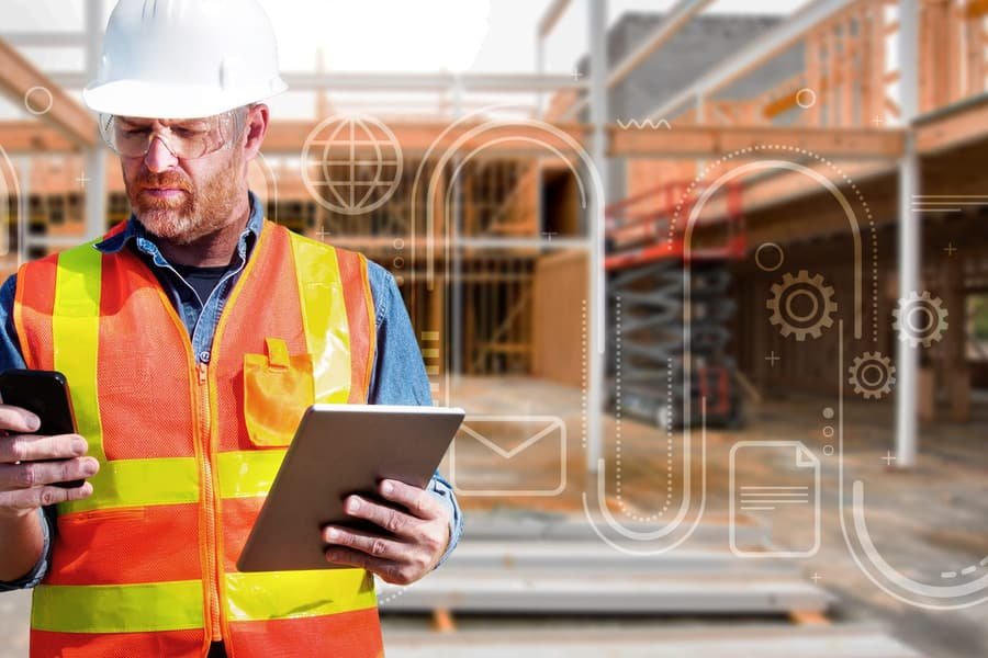 Senior team reviewing drawings on a ground-up construction site